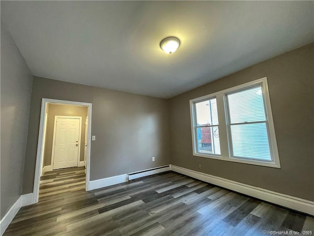 158 Martin St, Hartford, CT 06120 - unfurnished room with dark wood finished floors, baseboards, baseboard heating, and a baseboard radiator