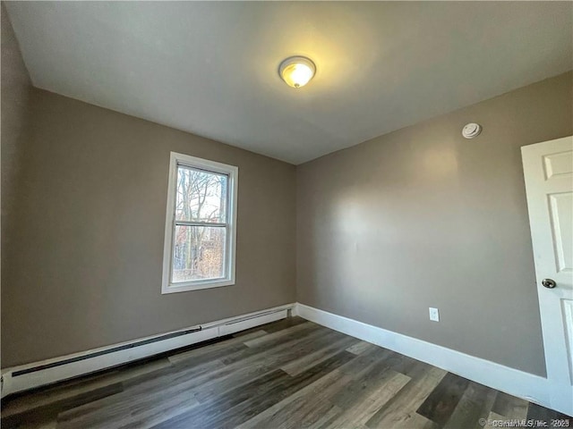 158 Martin St, Hartford, CT 06120 - unfurnished room featuring baseboard heating, dark wood finished floors, baseboards, and a smoke detector