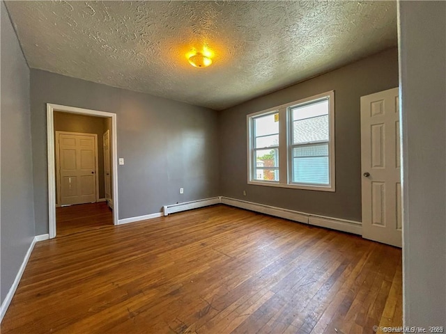 158 Martin St, Hartford, CT 06120 - spare room featuring hardwood / wood-style floors, baseboards, a textured ceiling, and a baseboard radiator