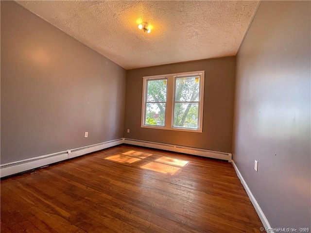 158 Martin St, Hartford, CT 06120 - spare room featuring a textured ceiling, wood finished floors, baseboards, and baseboard heating