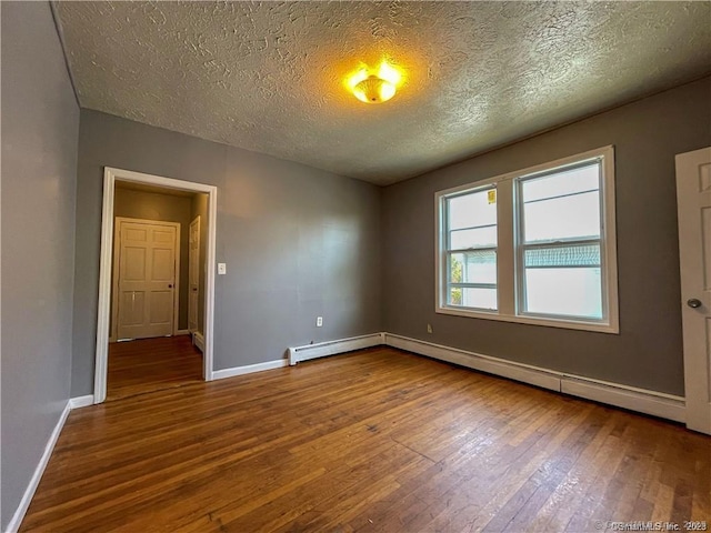 158 Martin St, Hartford, CT 06120 - unfurnished room featuring wood-type flooring, baseboards, a textured ceiling, a baseboard radiator, and a baseboard heating unit