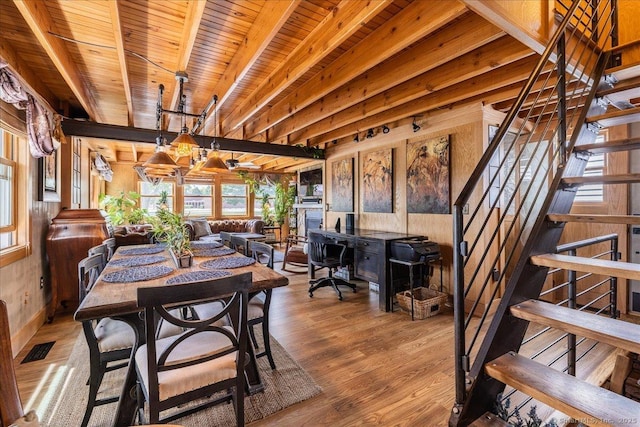 311 Captain Thomas Blvd, West Haven, CT 06516 - dining room with wood finished floors, stairway, wooden ceiling with exposed beams, and wooden walls