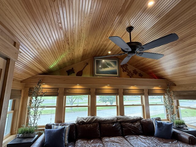 311 Captain Thomas Blvd, West Haven, CT 06516 - living area featuring wood ceiling, lofted ceiling, a ceiling fan, and wood walls
