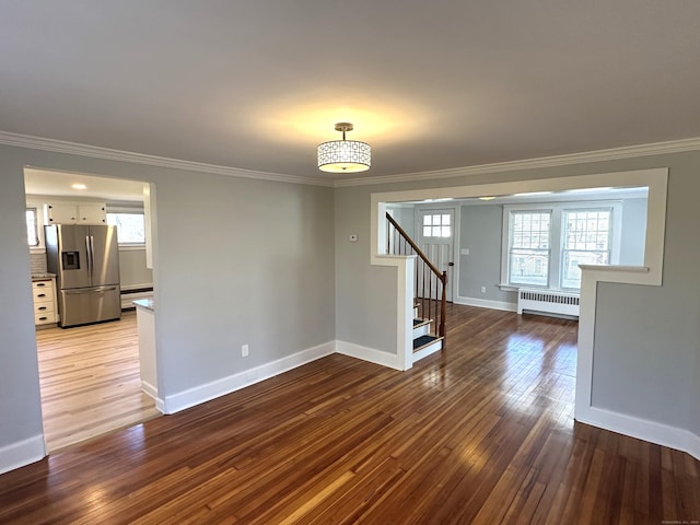 1188 Worthington Rdg, Berlin, CT 06037 - empty room with radiator, crown molding, stairway, wood-type flooring, and baseboards