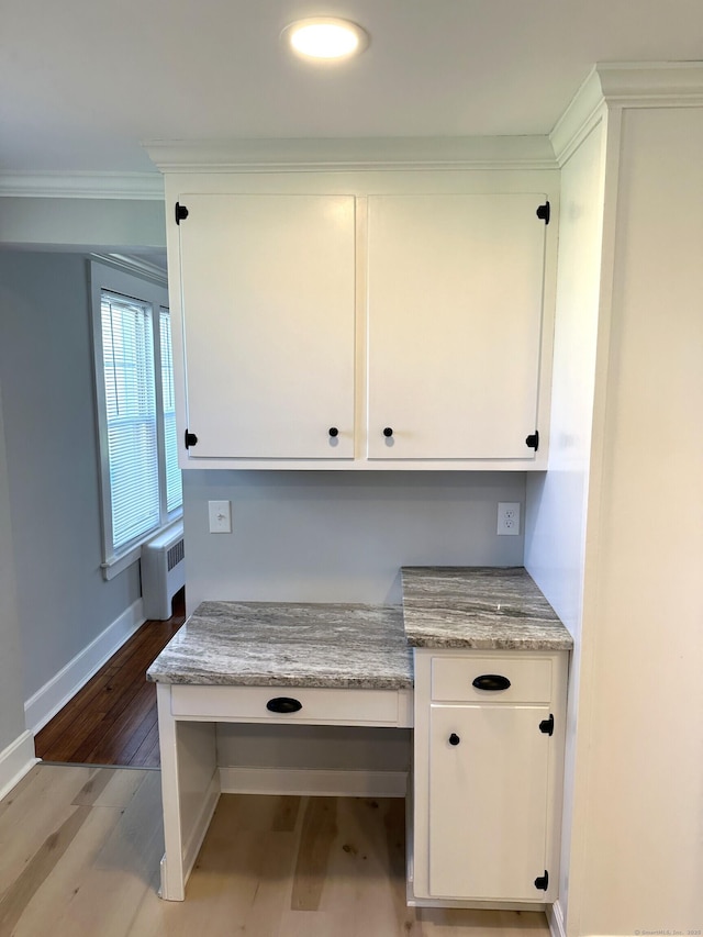 1188 Worthington Rdg, Berlin, CT 06037 - unfurnished office with radiator, light wood finished floors, baseboards, ornamental molding, and built in desk