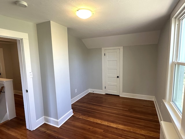 1188 Worthington Rdg, Berlin, CT 06037 - spare room with a smoke detector, dark wood finished floors, baseboards, and vaulted ceiling
