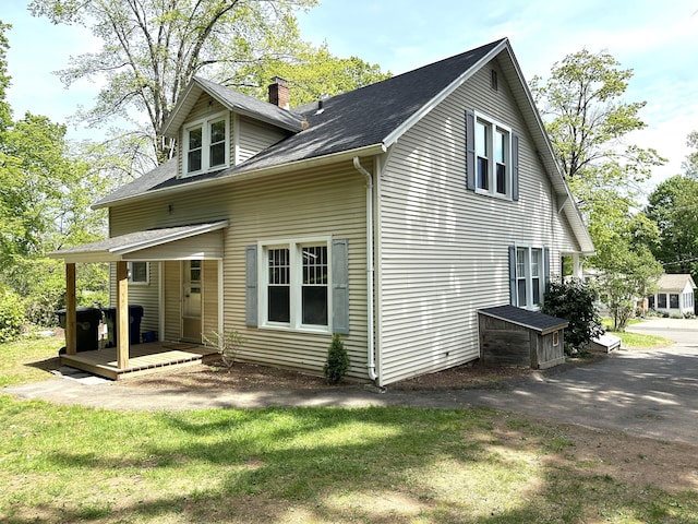1188 Worthington Rdg, Berlin, CT 06037 - rear view of house with a chimney and roof with shingles