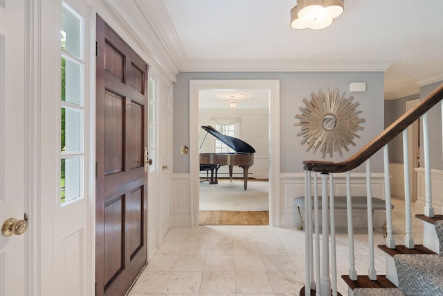 104 Cheesespring Rd, Wilton, CT 06897 - foyer entrance featuring a decorative wall, crown molding, stairway, and wainscoting