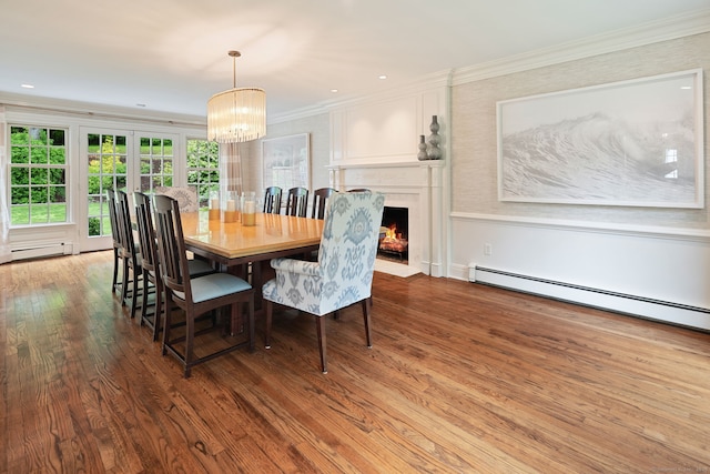 104 Cheesespring Rd, Wilton, CT 06897 - dining space featuring ornamental molding, a chandelier, wood finished floors, a baseboard heating unit, and a fireplace with flush hearth