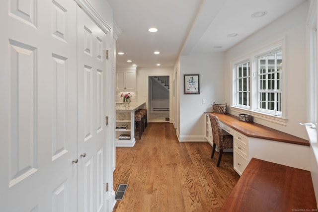 104 Cheesespring Rd, Wilton, CT 06897 - home office featuring light wood-style floors, recessed lighting, baseboards, and built in desk