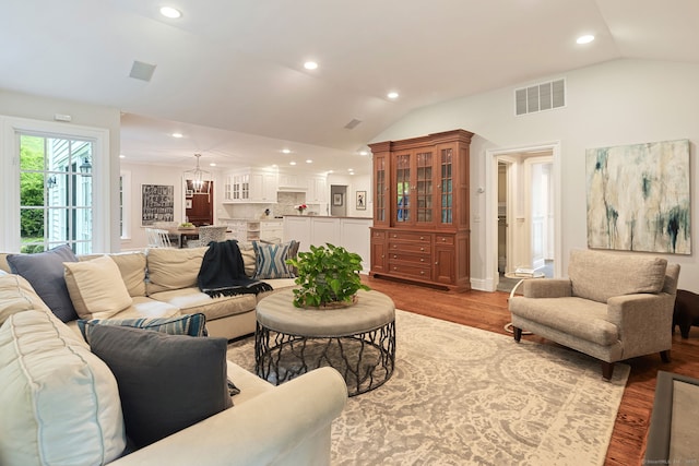 104 Cheesespring Rd, Wilton, CT 06897 - living area with lofted ceiling, recessed lighting, wood finished floors, a chandelier, and baseboards