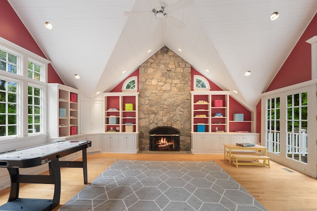 104 Cheesespring Rd, Wilton, CT 06897 - playroom with healthy amount of natural light, wood finished floors, lofted ceiling, a fireplace, and recessed lighting