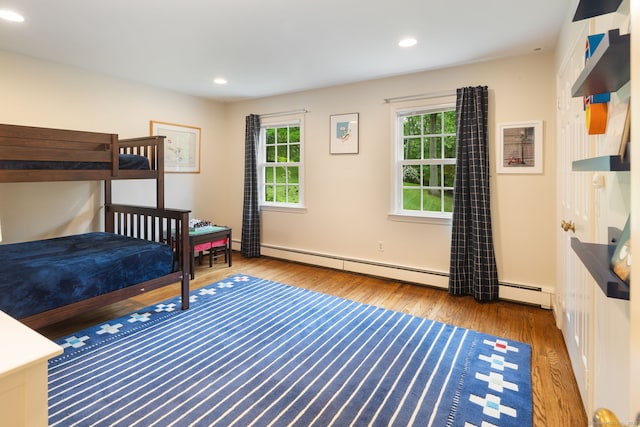 104 Cheesespring Rd, Wilton, CT 06897 - bedroom featuring baseboard heating, wood finished floors, and recessed lighting