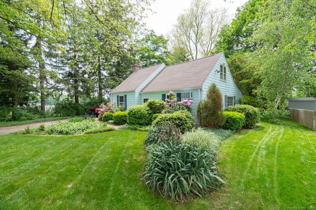 216 Belleview Ave, Southington, CT 06489 - view of home's exterior with a chimney and a lawn
