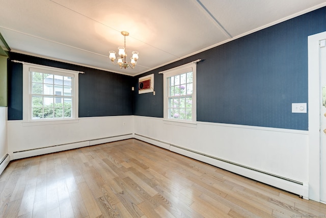 216 Belleview Ave, Southington, CT 06489 - empty room featuring a chandelier, a wainscoted wall, crown molding, wood finished floors, and a baseboard heating unit