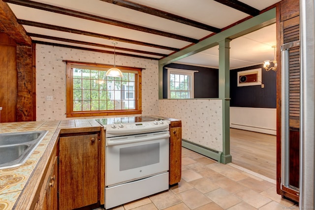 216 Belleview Ave, Southington, CT 06489 - kitchen with a baseboard radiator, electric range, tile counters, wallpapered walls, and hanging light fixtures