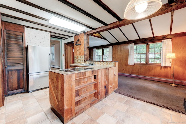 216 Belleview Ave, Southington, CT 06489 - kitchen with freestanding refrigerator, a baseboard radiator, beam ceiling, black electric cooktop, and light colored carpet