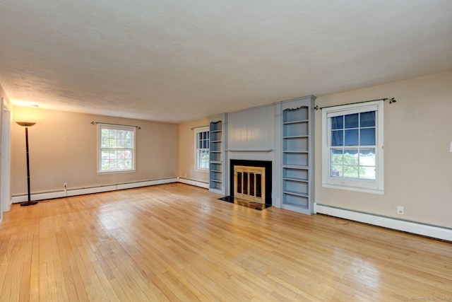 216 Belleview Ave, Southington, CT 06489 - unfurnished living room featuring light wood-type flooring, a baseboard heating unit, a fireplace with flush hearth, and baseboards