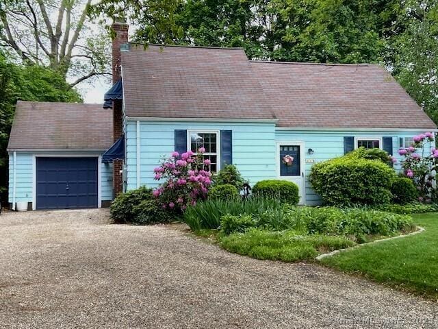 216 Belleview Ave, Southington, CT 06489 - new england style home featuring a chimney, an attached garage, asphalt driveway, and a shingled roof