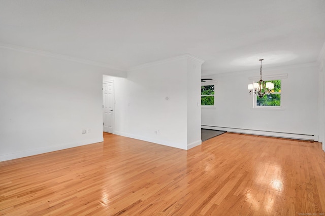 71 Mountain Laurel Dr Unit 71, Wethersfield, CT 06109 - empty room featuring a baseboard heating unit, a chandelier, crown molding, light wood-type flooring, and baseboards