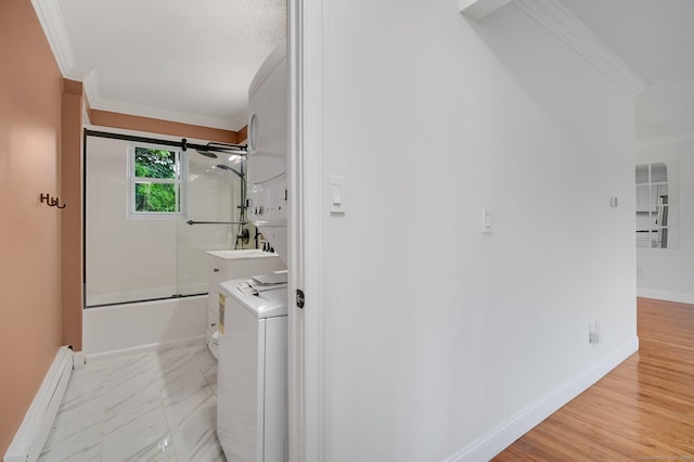 71 Mountain Laurel Dr Unit 71, Wethersfield, CT 06109 - laundry area with a baseboard heating unit, crown molding, baseboards, and washer and dryer