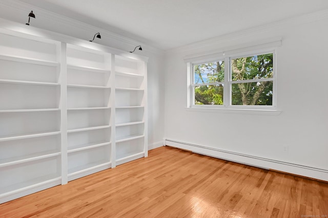 71 Mountain Laurel Dr Unit 71, Wethersfield, CT 06109 - unfurnished room with a baseboard heating unit, ornamental molding, and light wood finished floors