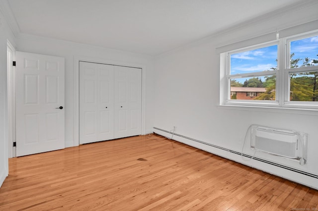 71 Mountain Laurel Dr Unit 71, Wethersfield, CT 06109 - unfurnished bedroom with a baseboard heating unit, light wood-style flooring, crown molding, multiple windows, and a closet