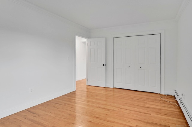 71 Mountain Laurel Dr Unit 71, Wethersfield, CT 06109 - unfurnished bedroom with ornamental molding, light wood-type flooring, baseboards, baseboard heating, and a closet