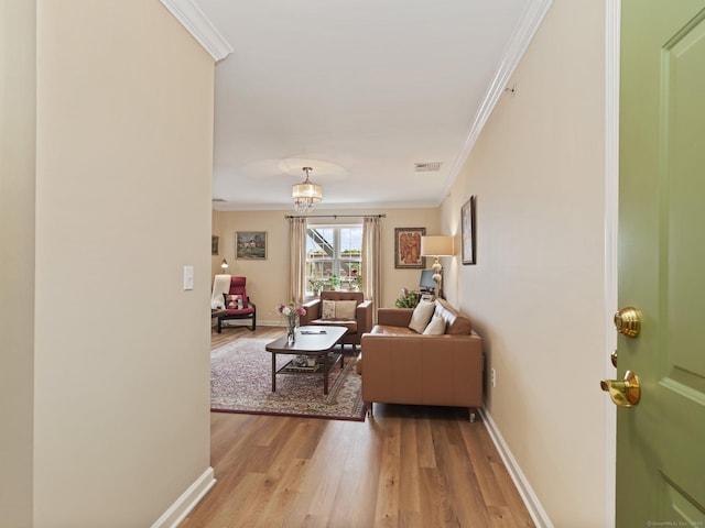 19 Isaacs St Apt 307, Norwalk, CT 06850 - living area featuring light wood finished floors, ornamental molding, and baseboards