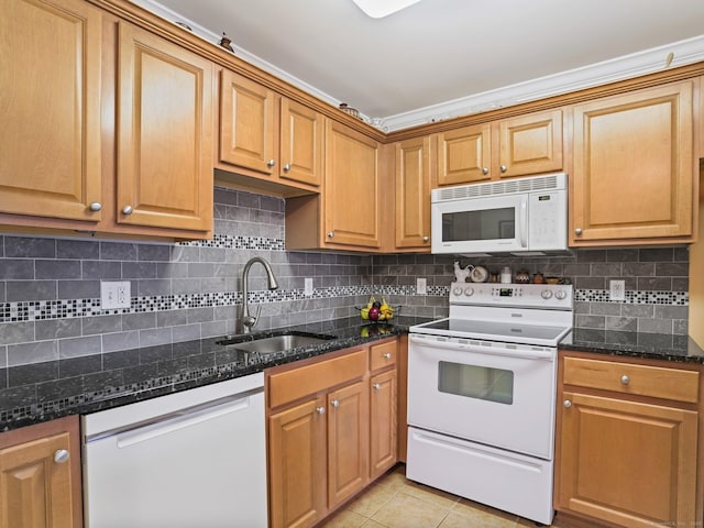 19 Isaacs St Apt 307, Norwalk, CT 06850 - kitchen with white appliances, a sink, decorative backsplash, light tile patterned floors, and dark stone countertops