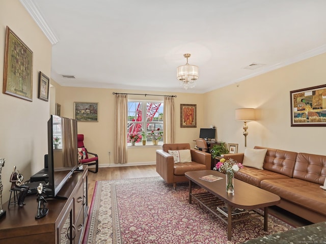 19 Isaacs St Apt 307, Norwalk, CT 06850 - living room featuring light wood-style flooring, crown molding, a chandelier, and baseboards