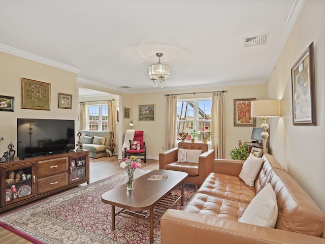 19 Isaacs St Apt 307, Norwalk, CT 06850 - living room featuring ornamental molding, wood finished floors, a chandelier, and baseboards