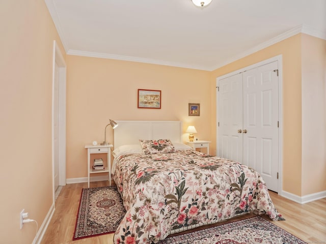 19 Isaacs St Apt 307, Norwalk, CT 06850 - bedroom featuring wood finished floors, ornamental molding, baseboards, and a closet