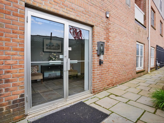 19 Isaacs St Apt 307, Norwalk, CT 06850 - view of exterior entry featuring brick siding
