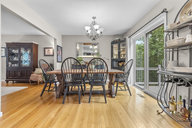 12 Colonial Heights Rd, East Haven, CT 06473 - dining room featuring wood finished floors and a chandelier
