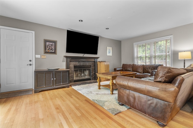 12 Colonial Heights Rd, East Haven, CT 06473 - living room with wood finished floors and a stone fireplace
