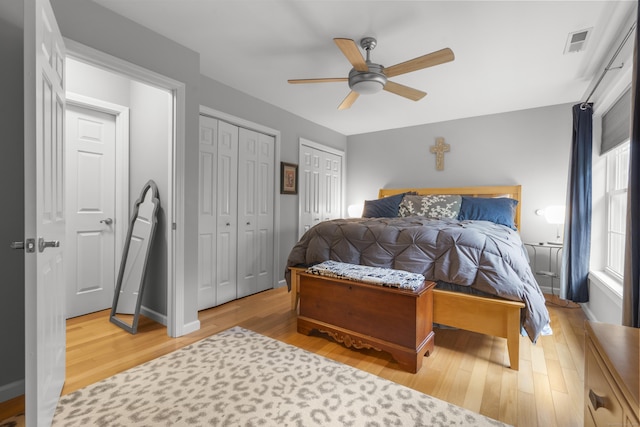 12 Colonial Heights Rd, East Haven, CT 06473 - bedroom featuring two closets, wood finished floors, and ceiling fan