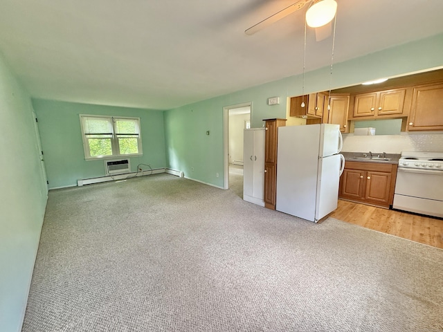 14 Arrowhead Way Apt C1, Woodbury, CT 06798 - kitchen with white appliances, a sink, light carpet, baseboard heating, and open floor plan