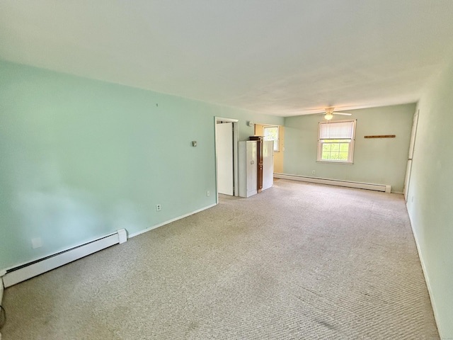 14 Arrowhead Way Apt C1, Woodbury, CT 06798 - unfurnished room with a baseboard radiator, light carpet, ceiling fan, and baseboards