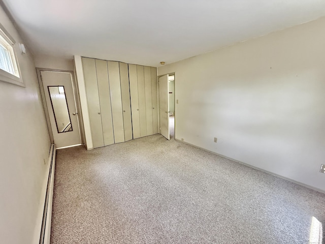 14 Arrowhead Way Apt C1, Woodbury, CT 06798 - unfurnished bedroom featuring a closet and baseboard heating