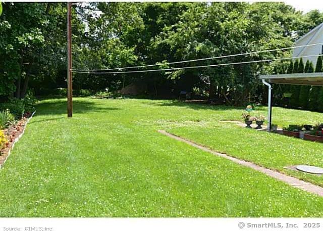33 Silver St, Branford, CT 06405 - view of green lawn featuring volleyball court and view of scattered trees
