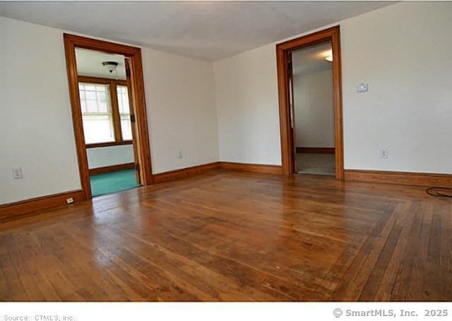 33 Silver St, Branford, CT 06405 - empty room featuring wood finished floors and baseboards