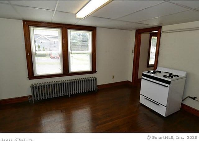 33 Silver St, Branford, CT 06405 - kitchen featuring white range with gas stovetop, radiator, baseboards, dark wood finished floors, and a drop ceiling