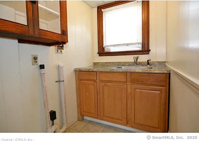 33 Silver St, Branford, CT 06405 - bathroom featuring a sink and tile patterned floors