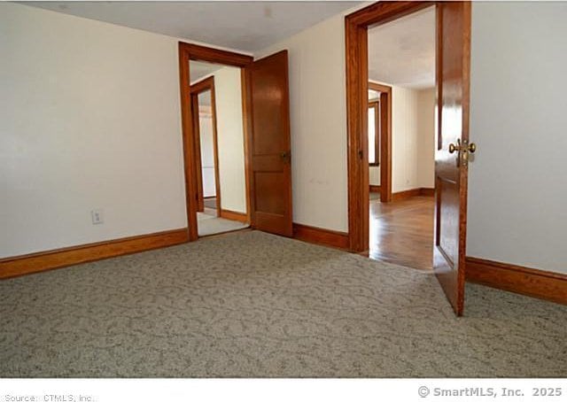 33 Silver St, Branford, CT 06405 - unfurnished room featuring carpet and baseboards