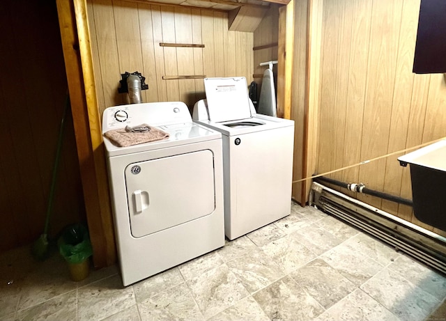 27 Eton Pl, New Britain, CT 06053 - washroom featuring independent washer and dryer, wood walls, and light stone finish flooring