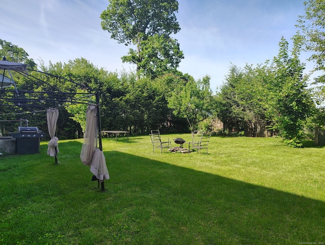27 Eton Pl, New Britain, CT 06053 - view of green lawn with an outdoor fire pit