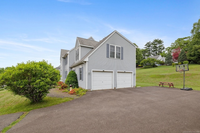 63 Old Cider Mill Rd, Southington, CT 06489 - view of side of home with an attached garage, driveway, a lawn, and a shingled roof