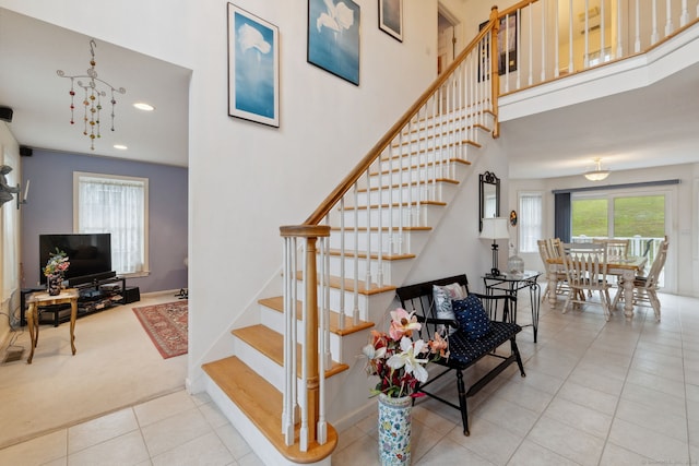 63 Old Cider Mill Rd, Southington, CT 06489 - stairway with tile patterned floors, carpet, a high ceiling, and recessed lighting