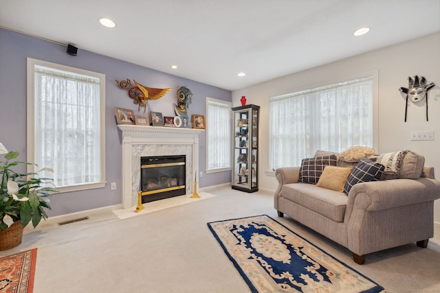 63 Old Cider Mill Rd, Southington, CT 06489 - carpeted living room featuring a high end fireplace, recessed lighting, plenty of natural light, and baseboards